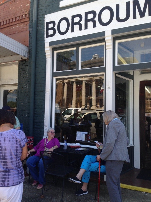 photo of Camille Borroum speaking to group of people